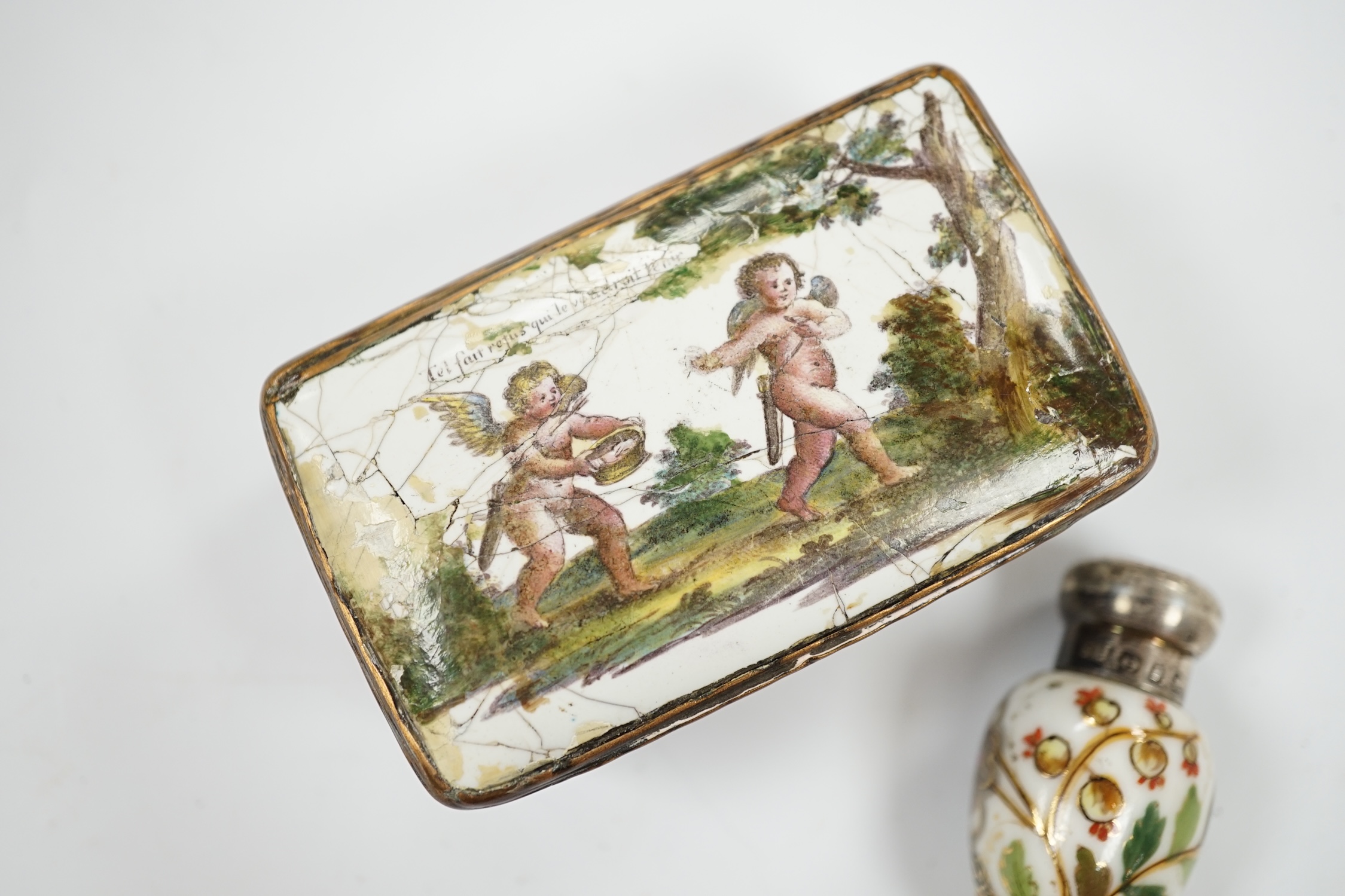 An 18th century French enamel snuff box and a late 19th century silver mounted porcelain scent bottle, largest 7.5cm. Condition - box poor, scent bottle fair
